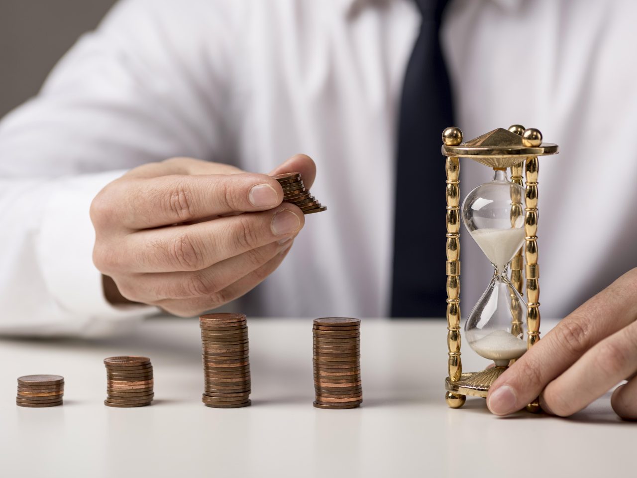 https://juarait.locx.in/wp-content/uploads/2024/02/front-view-businessman-with-coins-hourglass-1280x960.jpg